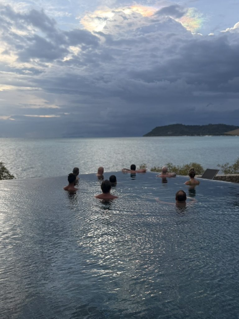 Eight men in the sea at sunset, Koh Samui