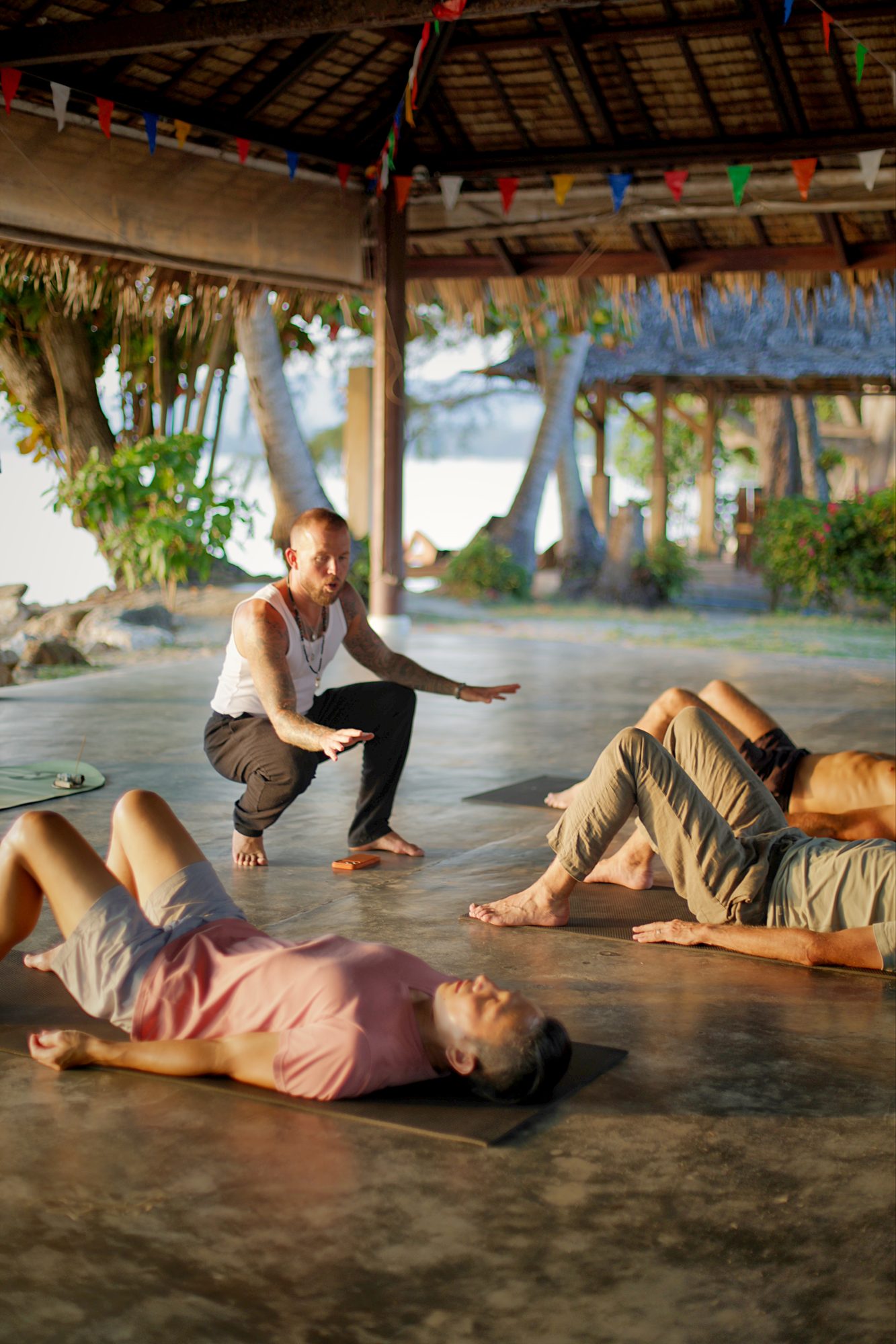 Morning movement session, thatched sala